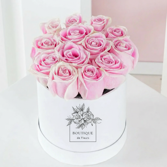 Blush Éclat luxury hatbox with fresh pink roses, available for flower delivery in Lahore