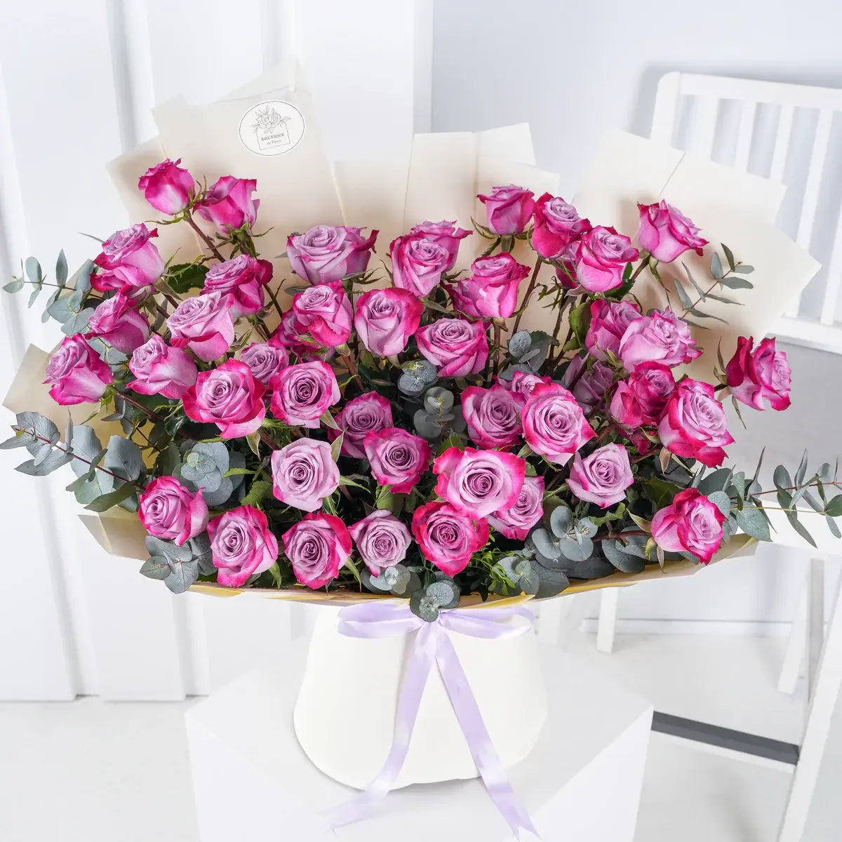 Bouquet of 50 fresh purple roses for luxury flower delivery in Lahore