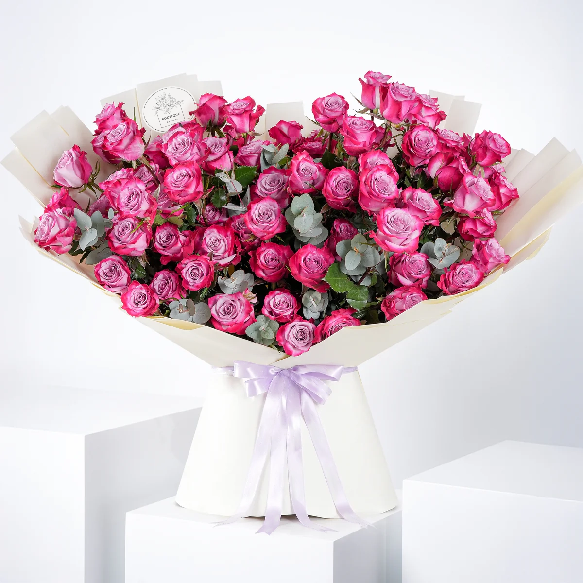 Bouquet of 100 fresh purple roses for luxury flower delivery in Lahore