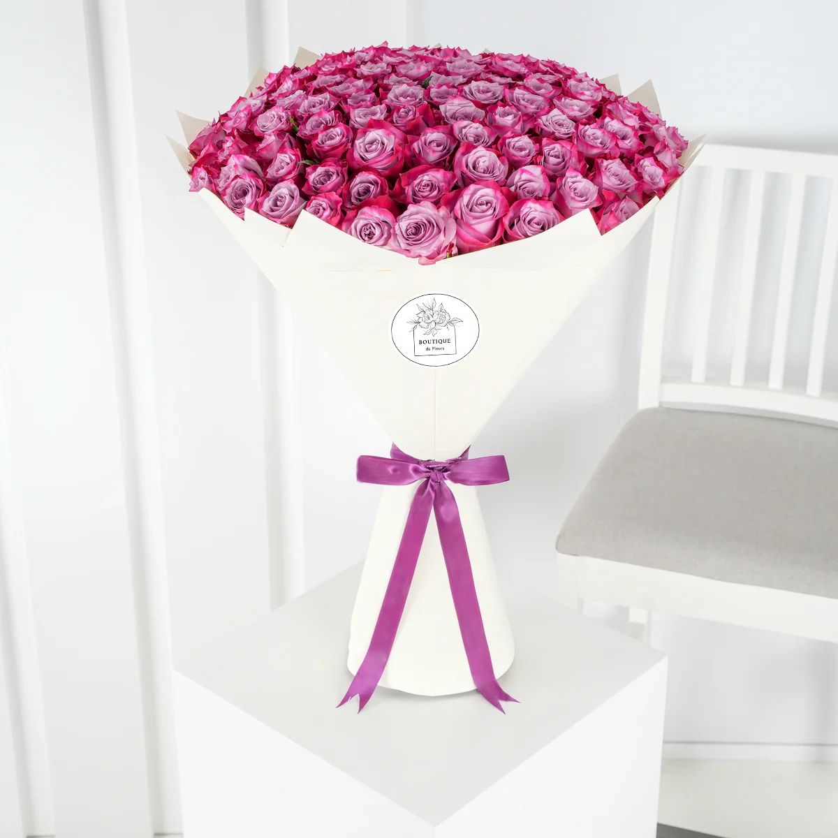 Bouquet of 100 fresh purple roses for luxury flower delivery in Lahore
