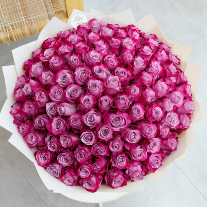 Bouquet of 100 fresh purple roses for luxury flower delivery in Lahore