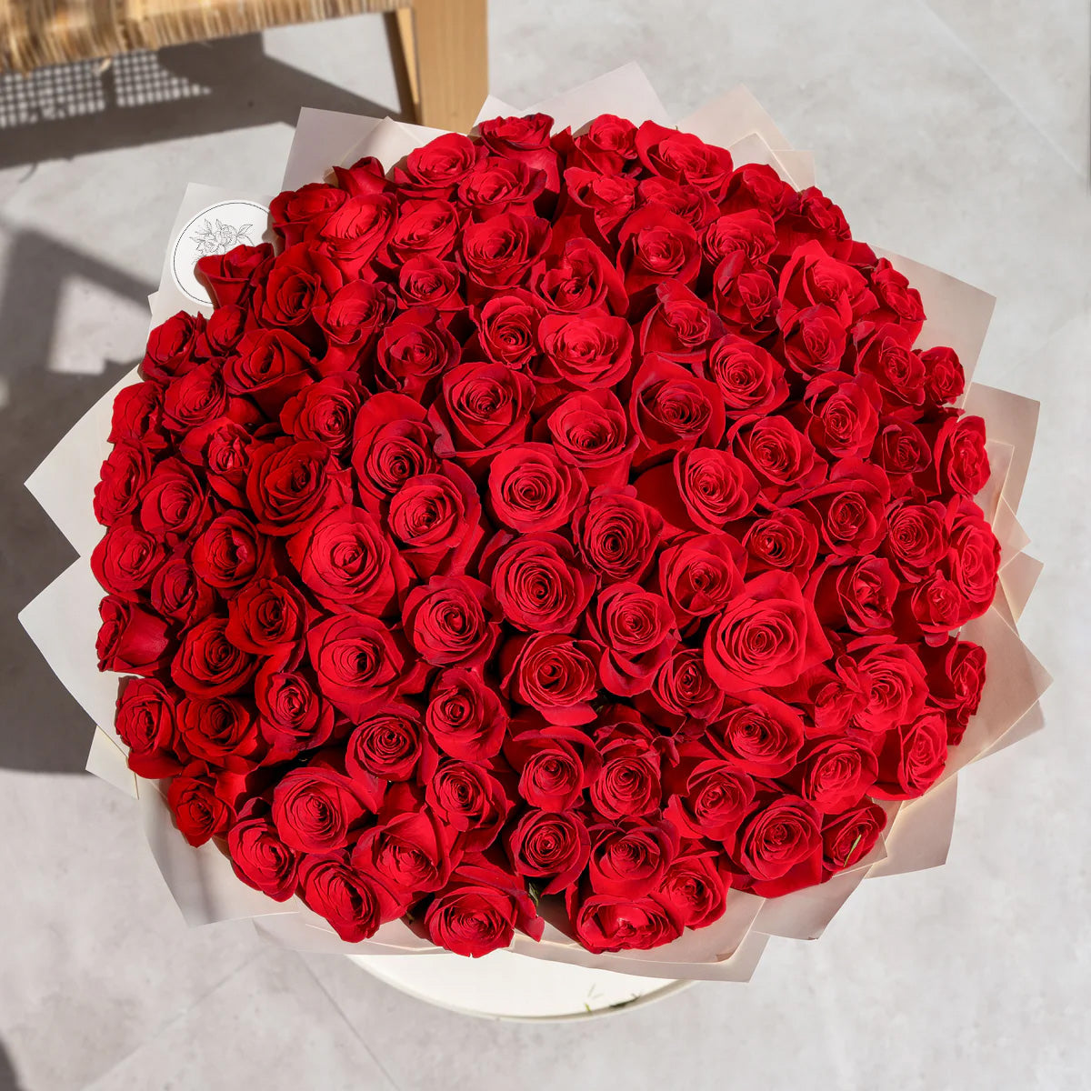Bouquet of 100 fresh red roses for luxury flower delivery in Lahore