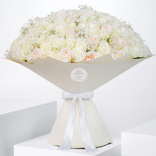 Amelia Grand bouquet with O’Hara roses, white roses, and delicate gypsophila, hand-tied in signature Grand wrap, available for flower delivery in Lahore