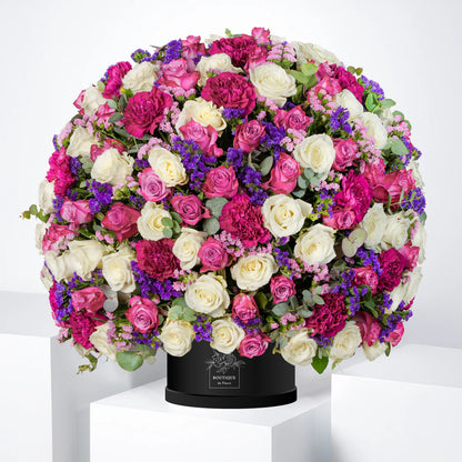 Amelia luxury hatbox with purple and white roses, purple carnations, and pink & purple statice, available for flower delivery in Lahore