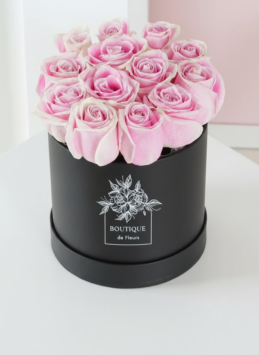 Blush Éclat luxury hatbox with fresh pink roses, available for flower delivery in Lahore