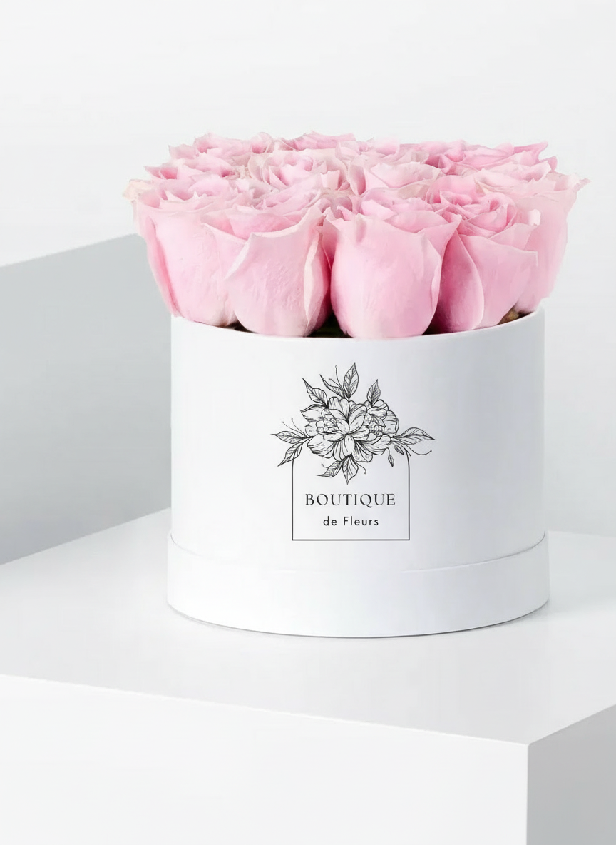 Blush Éclat luxury hatbox with fresh pink roses, available for flower delivery in Lahore