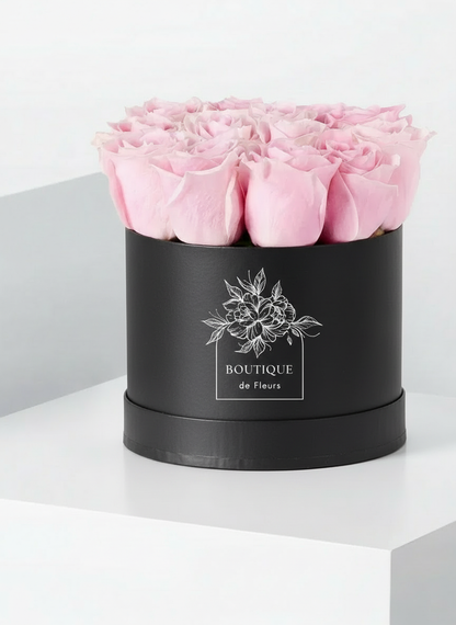Blush Éclat luxury hatbox with fresh pink roses, available for flower delivery in Lahore