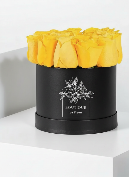 Golden Cheer luxury hatbox flower arrangement with fresh blooms, available for flower delivery in Lahore.