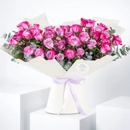 Bouquet of 50 fresh purple roses for luxury flower delivery in Lahore