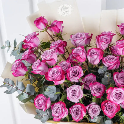Bouquet of 50 fresh purple roses for luxury flower delivery in Lahore